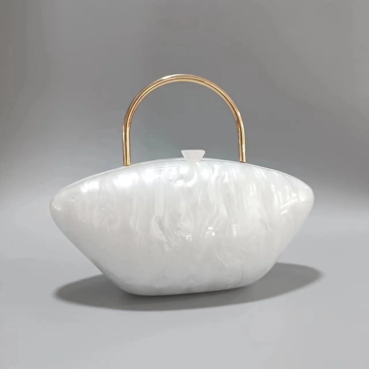 white marble clutch bag with gold handle
