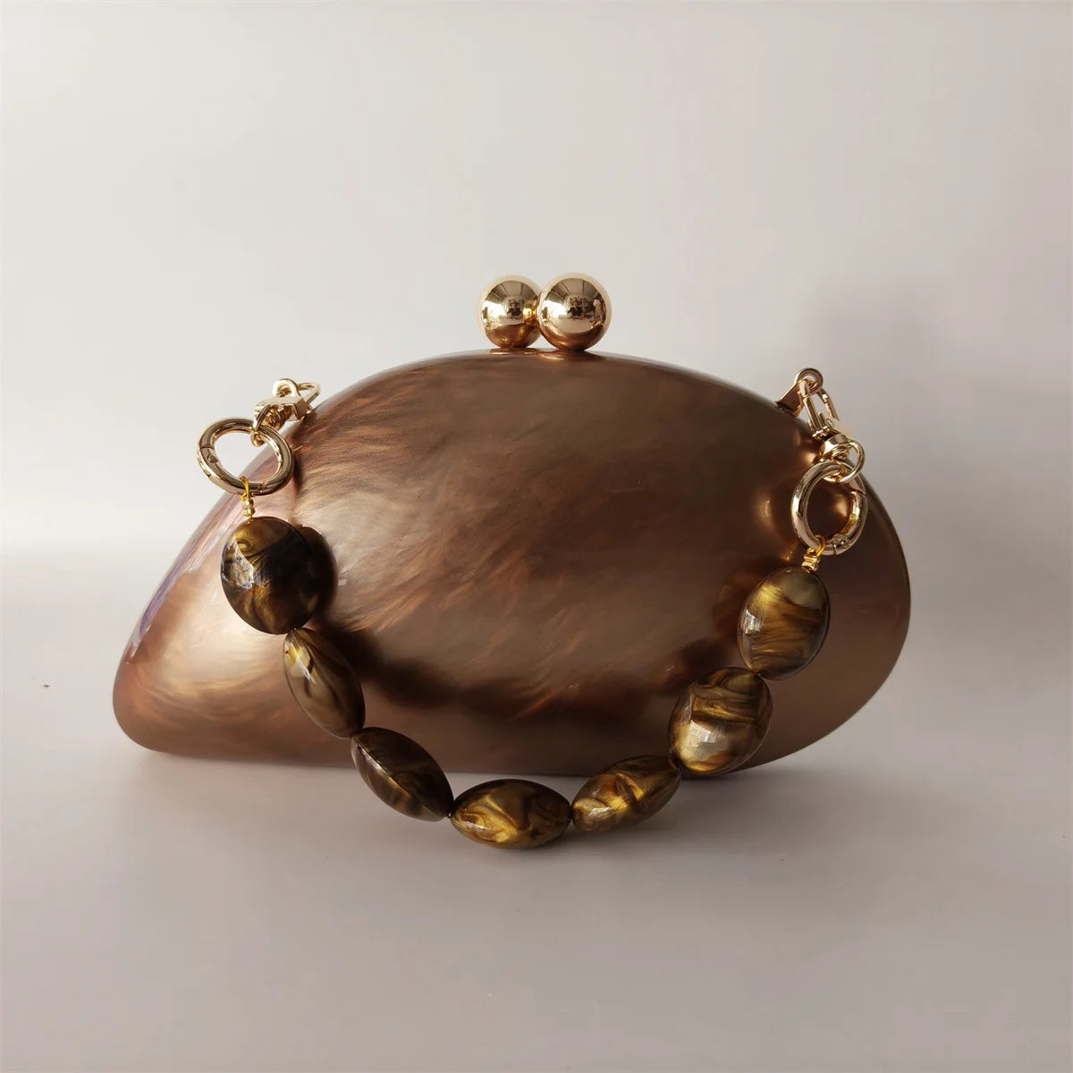 brown marble effect clutch with gold chain