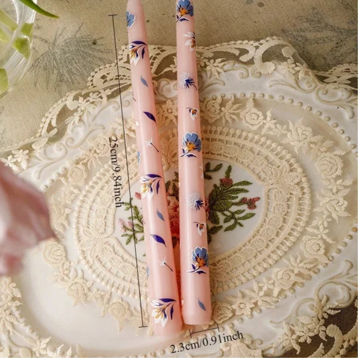 pink and blue painted tall candle