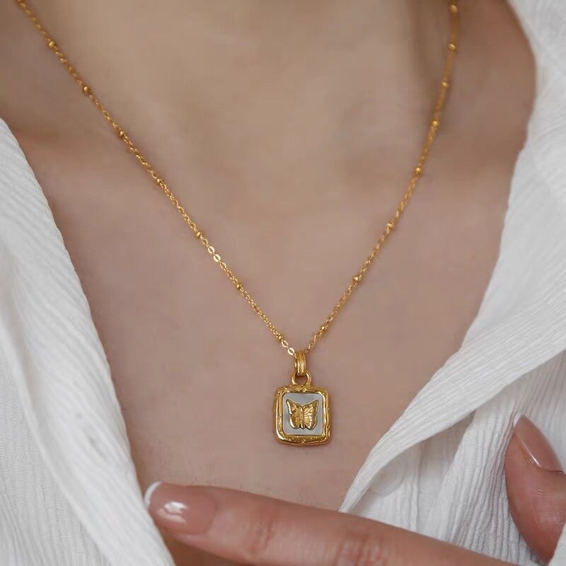 gold chain with butterfly pendant