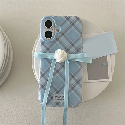 A blue plaid iPhone case with a rose ribbon and a bow
