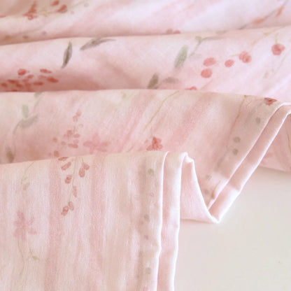 Close-up of pink fabric with floral pattern