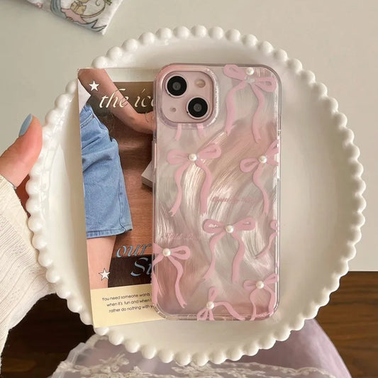 Phone case with pink bow design 