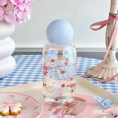 Clear bottle with floral design 