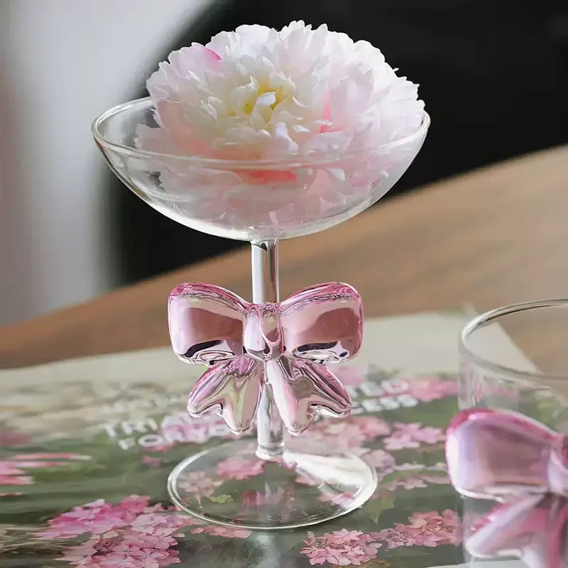 Decorative glass with a pink bow 