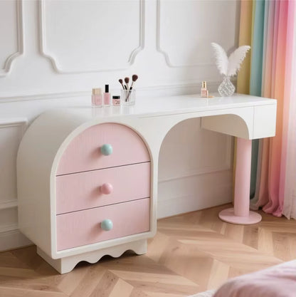 White vanity table with abstract pink drawers 