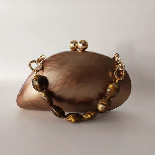brown marble effect clutch with gold chain 