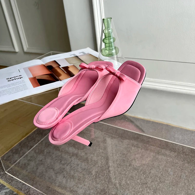 pink bow high heeled slip on mules