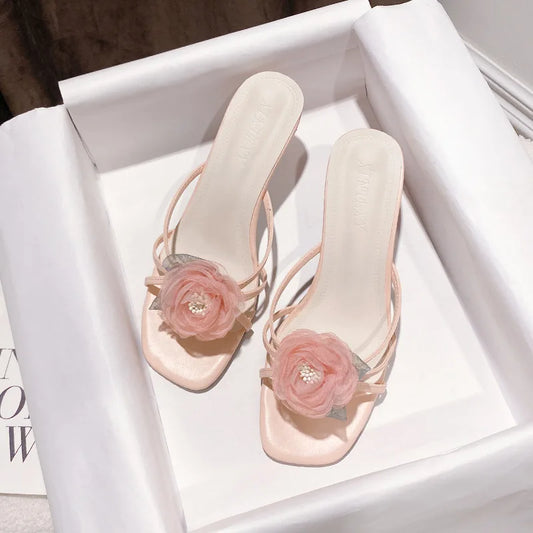 pink sandals with orchid flower motif 