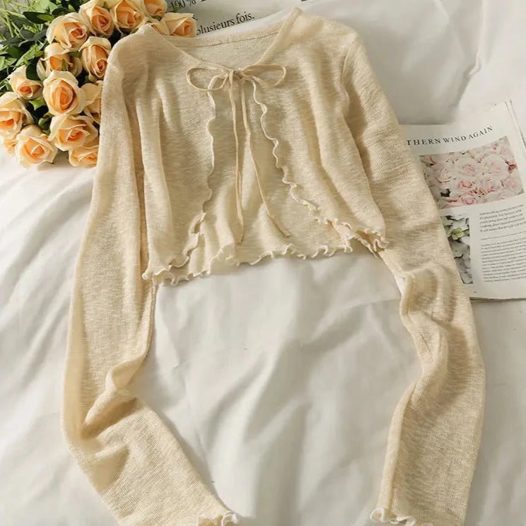 cream cardigan with bow 