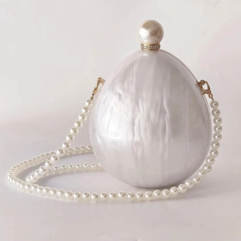 pearl oval clutch bag 
