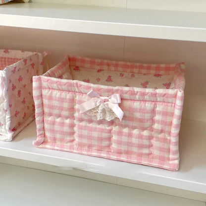 Pink checkered storage basket with a bow 