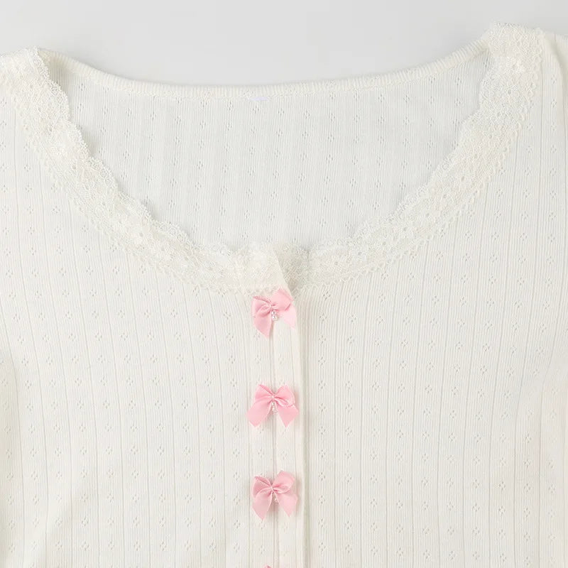 White eye let cardigan with pink bows 