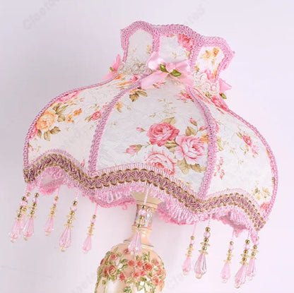Decorative lampshade with floral patterns and pink accents 