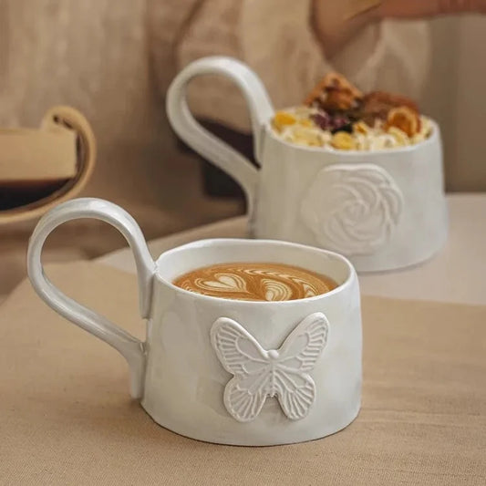 White ceramic mug with butterfly design 