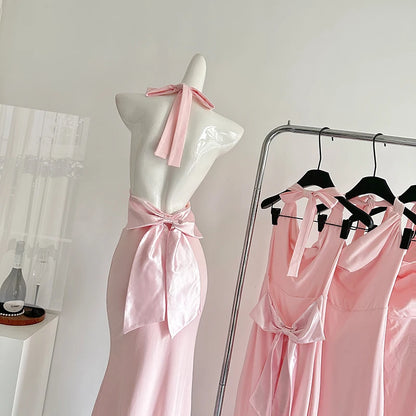backless dress with pink bow 