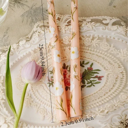 orange and white floral candle 