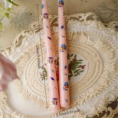 pink and blue painted tall candle 