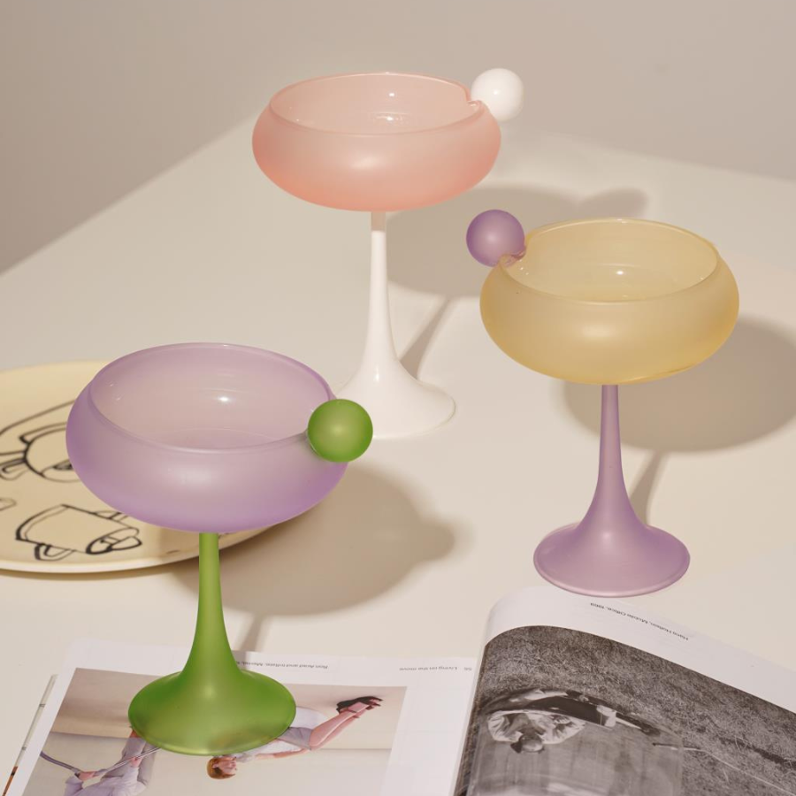 Bubblegum pink, yellow champagne cocktail glasses with ball 