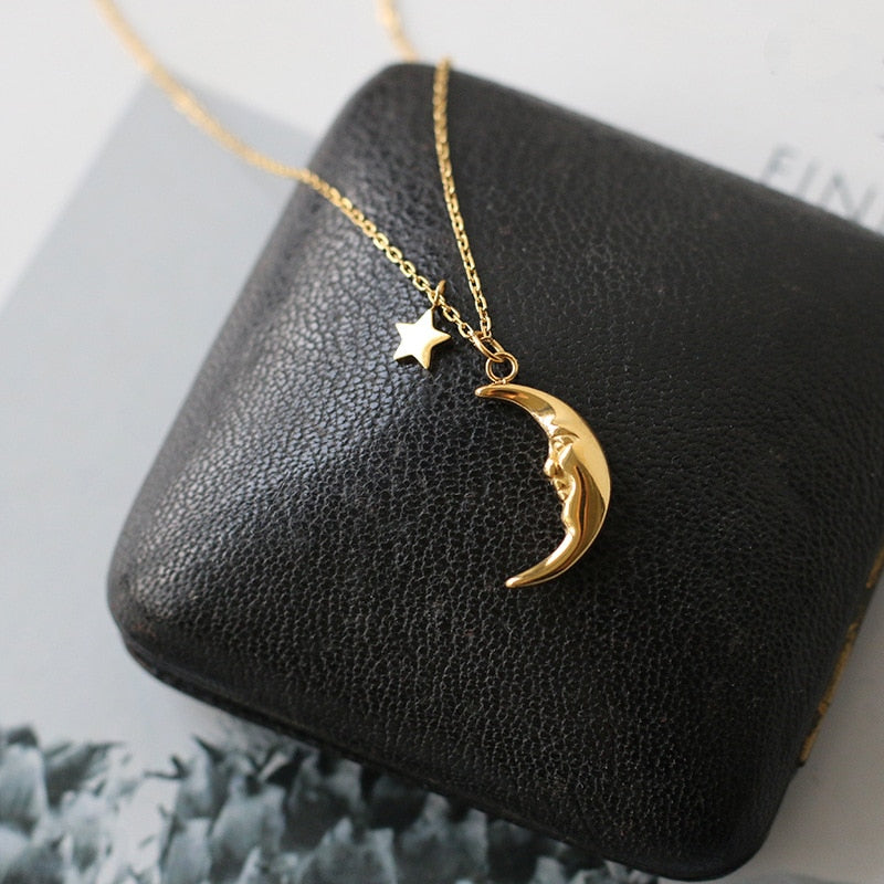 Gold crescent moon pendant necklace with star 