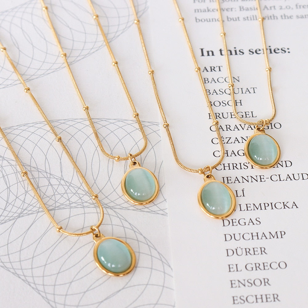 Delicate gold necklace with aqua opal stone pendant 
