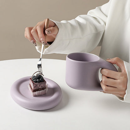 purple coffee cup and saucer 