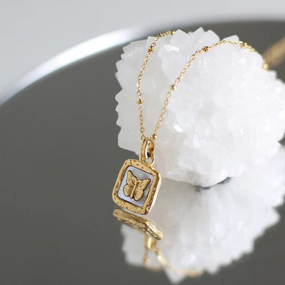 gold butterfly charm necklace